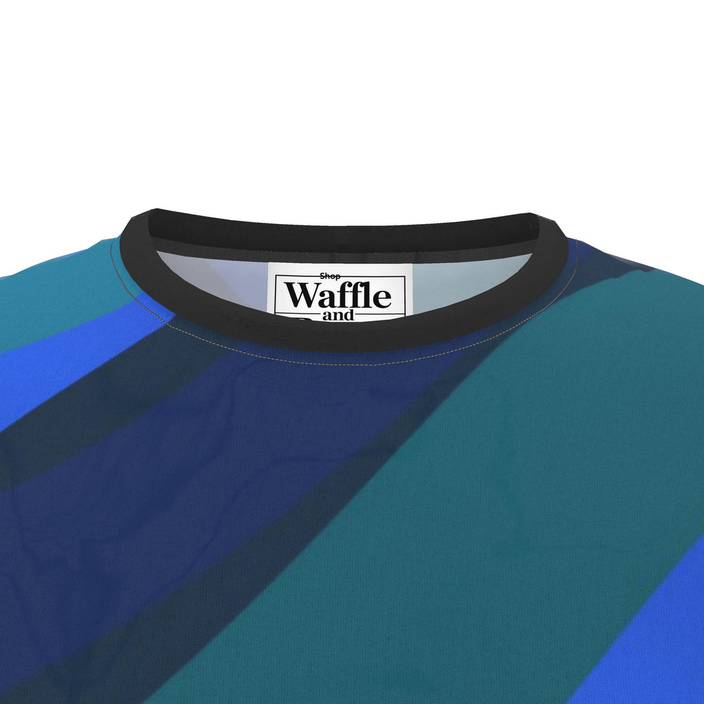 Cobalt Current T-shirt detail showing the dark crew neck, blue printed fabric and inside label.