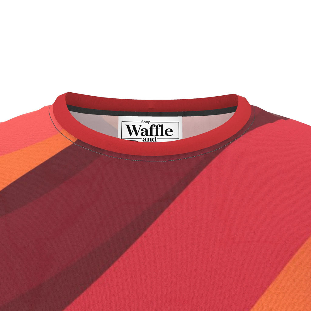 Solar Current T-shirt detail showing the red crew neck, warm-color printed fabric and inside label.