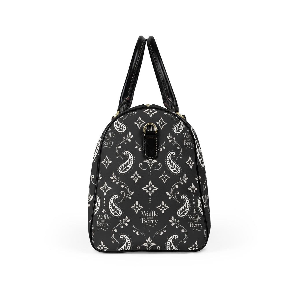 Black Paisley travel bag, opposite end view showing the rounded profile, black handles and cream paisley print.