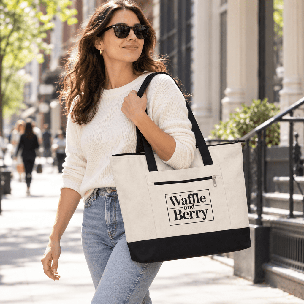 Illustrative model carrying the Natural/Black Waffle and Berry zippered canvas tote on a New York street.