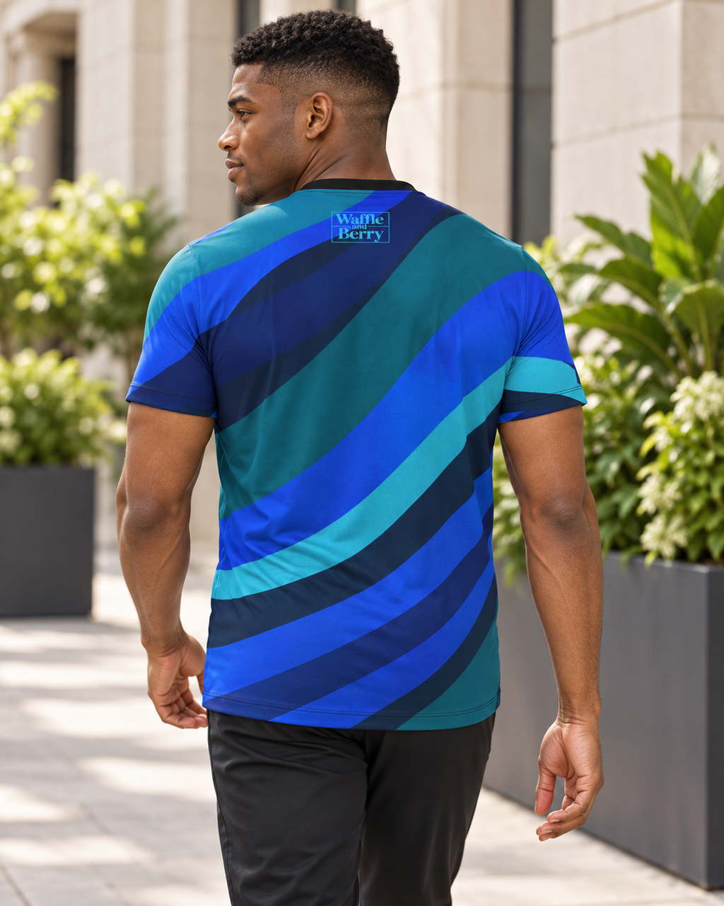AI-generated lifestyle illustration of Cobalt Current men's T-shirt, back view showing light-blue Waffle and Berry box logo.