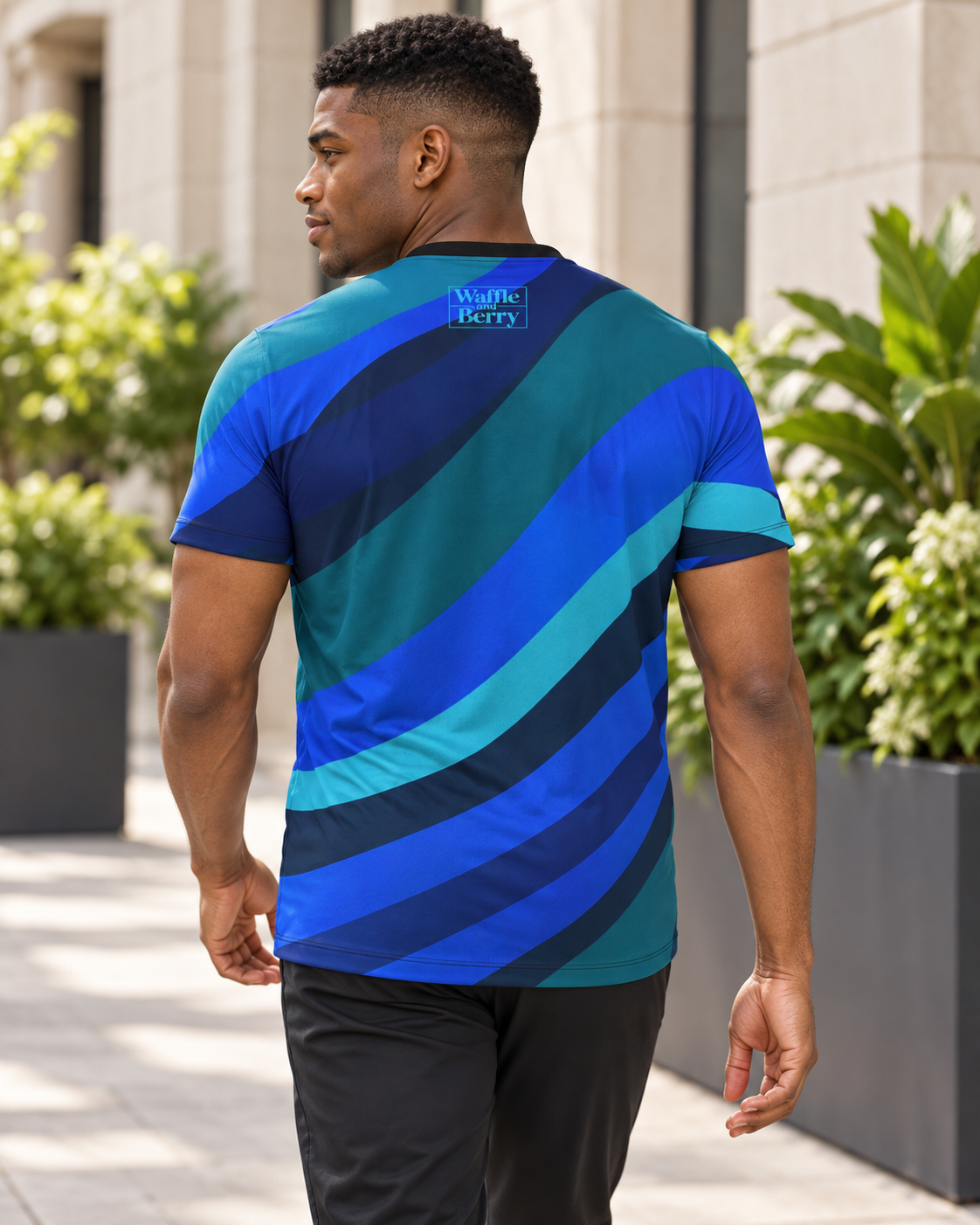 AI-generated lifestyle illustration of Cobalt Current men's T-shirt, back view showing light-blue Waffle and Berry box logo.