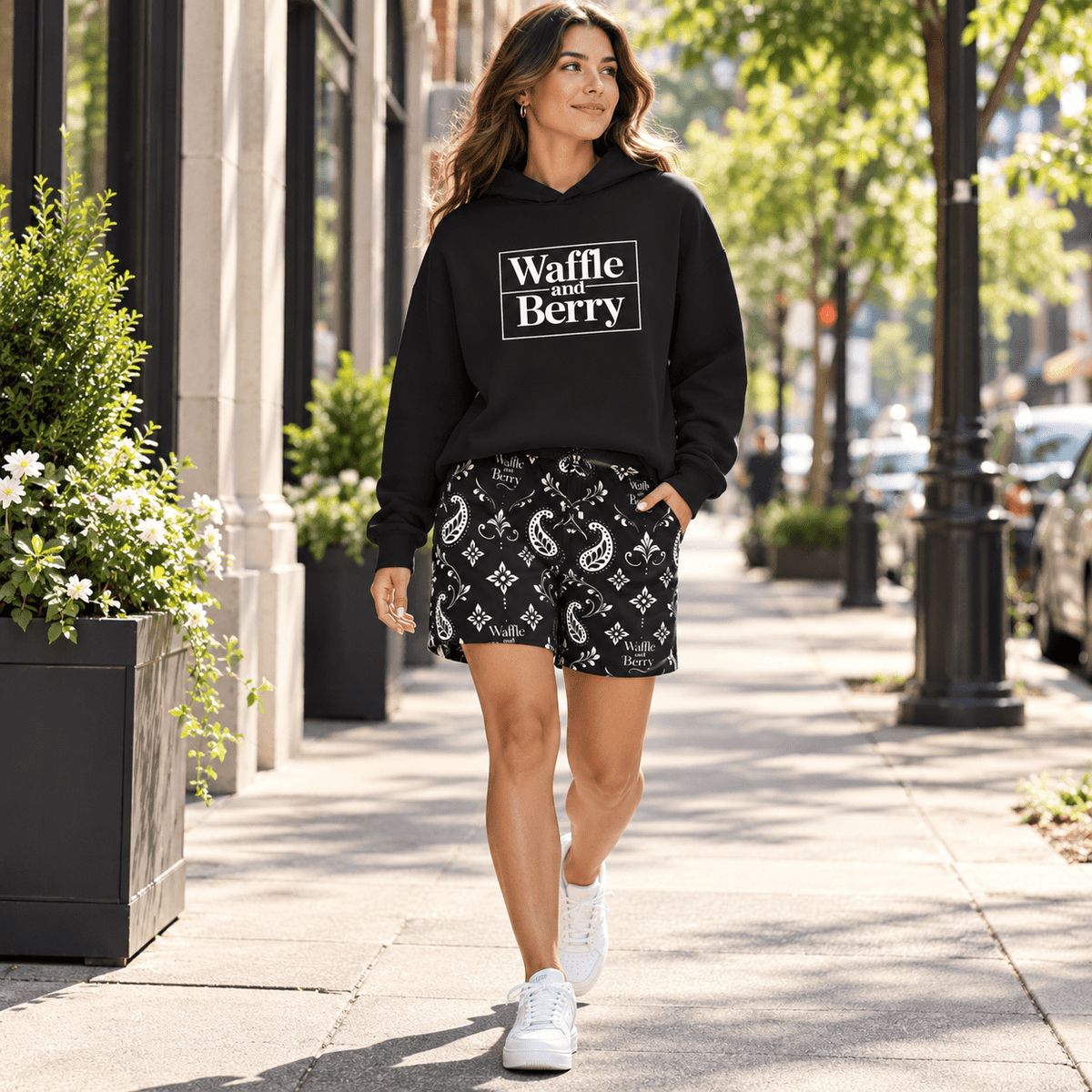 Model wearing Waffle and Berry Hoodie and paisley shorts, walking