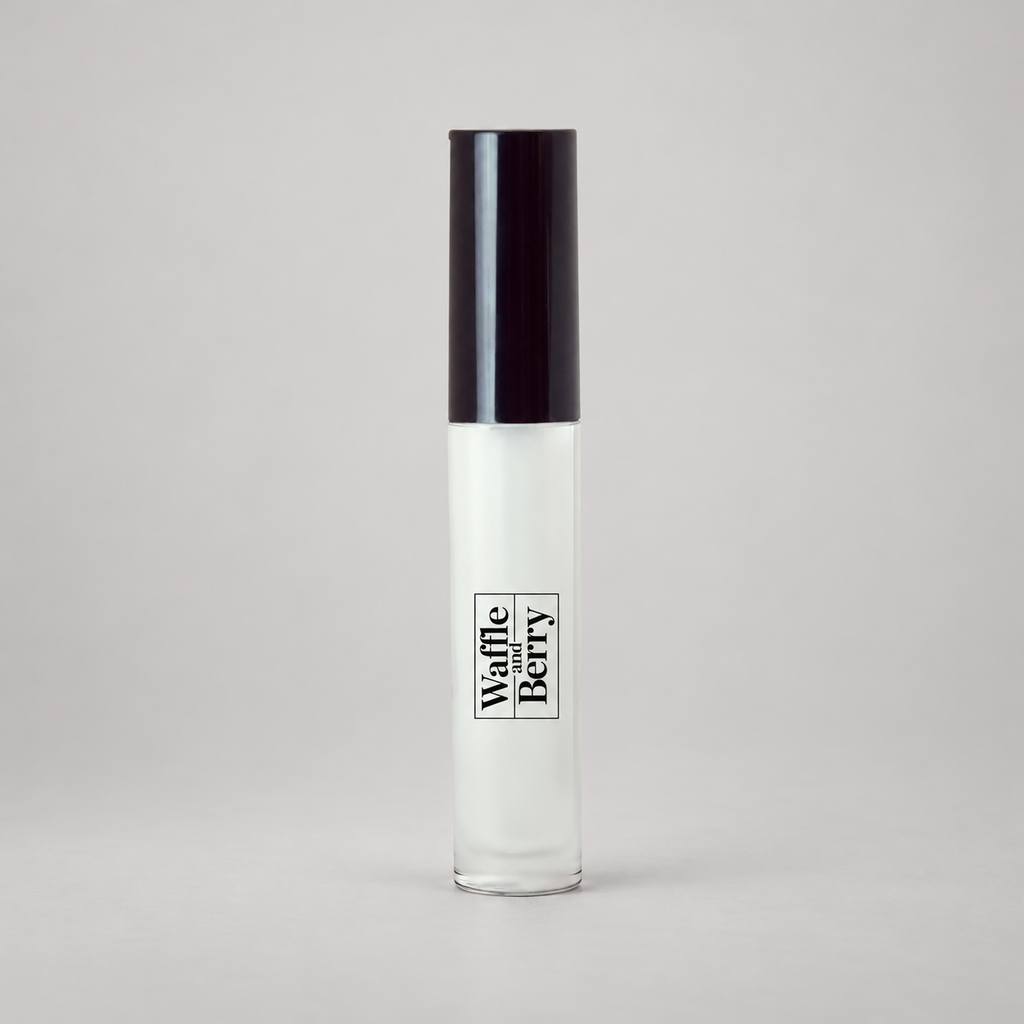 AI-assisted product-only studio illustration based on the authentic Waffle and Berry Clear lip gloss packaging.