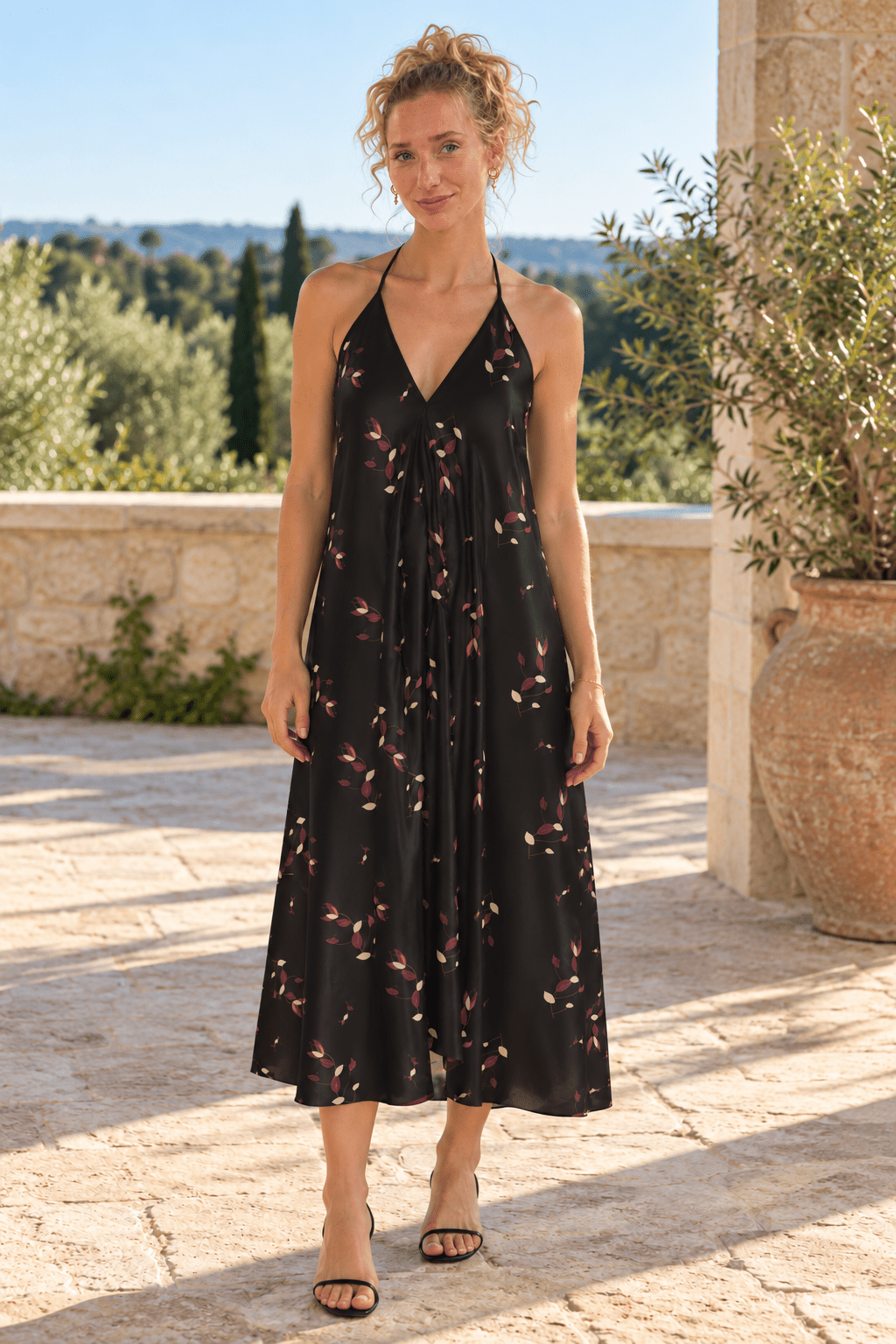 AI styling preview: Evening Petals midi halterneck dress. Illustrative fit and print placement; refer to original supplier product views and size guides.