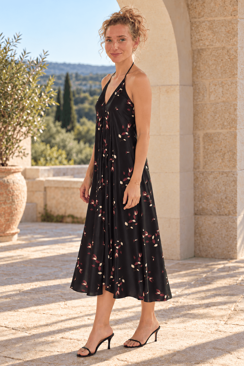 AI styling preview: Evening Petals midi halterneck dress. Illustrative fit and print placement; refer to original supplier product views and size guides.