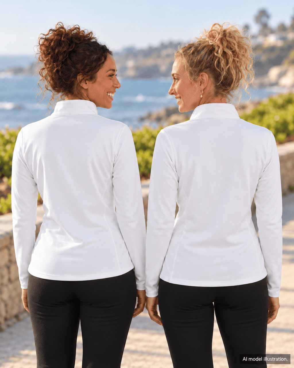 AI model illustration: two sisters showing the plain back of the white Waffle and Berry women's quarter-zip on a coastal walkway.